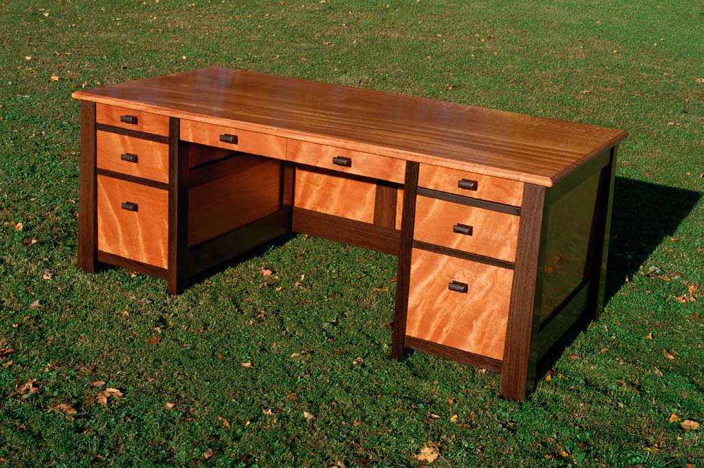The working side of the curly mahogany desk. Truly a one of a kind desk. This desk series has the option all drawers can be opened or locked by a key.