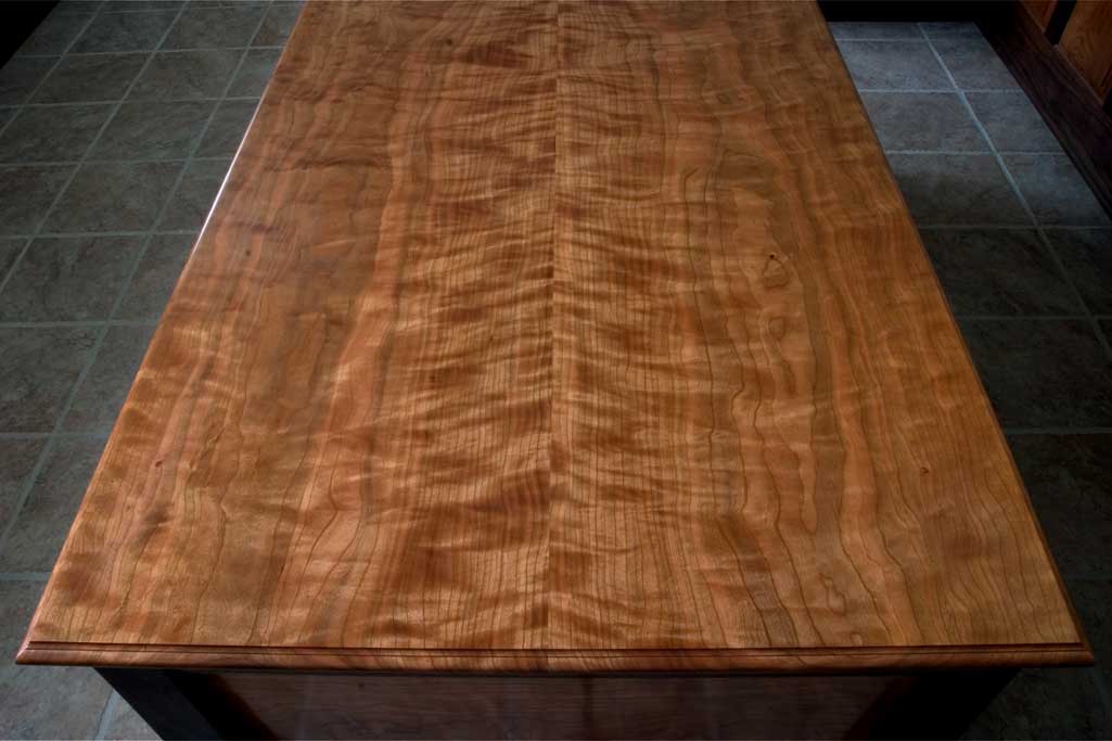Pennsylvania cherry has some of the finest color and figure available. This is a shot of the top of a signature desk.