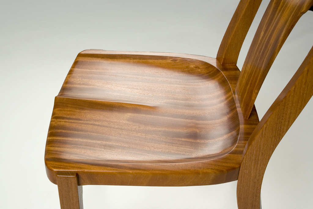 The chair seats were scooped and scraped from bookmatched 12/4 slabs of 20" wide