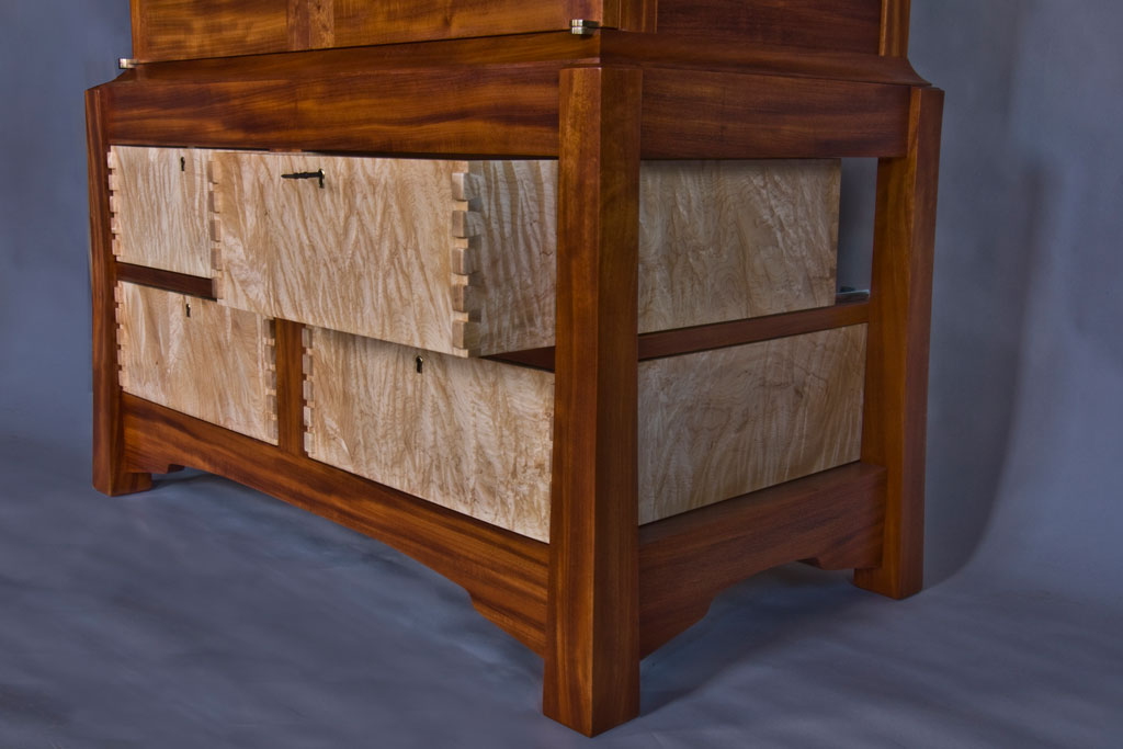 These curly maple drawers were too nice to hide inside a box, so we made the cabinet open all around. The slightly raised dovetails are a signature element from Scott Todd, our shop manager.