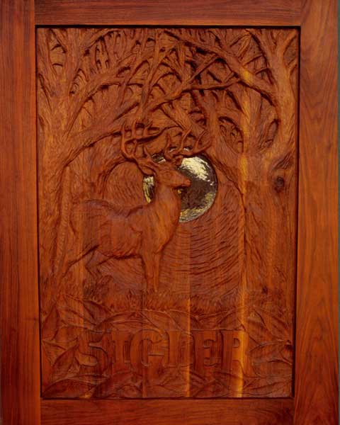 Carved walnut entry door to a small home in the woods. Another collaboration with Hopen Studio.