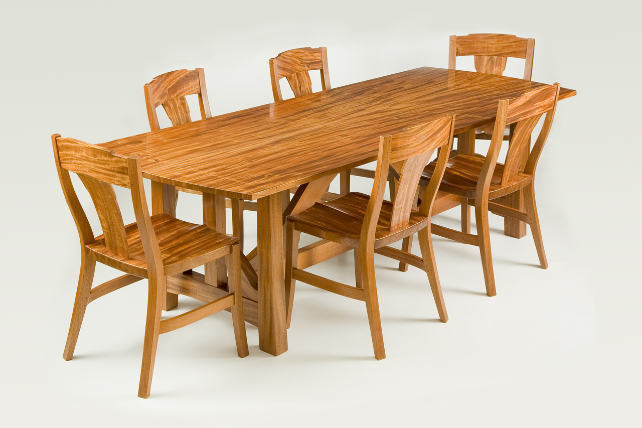 One incredible log of ribbon grain mahogany inspired this dining room table and chairs.