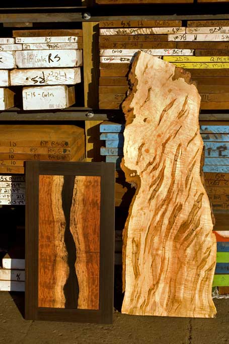 The wood usually directs our design. We travel broadly to connect with a great selection of rare material. The bubinga panel on the left was made after we saw how beautiful the scrap from the edge of the tree was. The unusual maple next to it is heavily marked by ambrosia beetle trails.