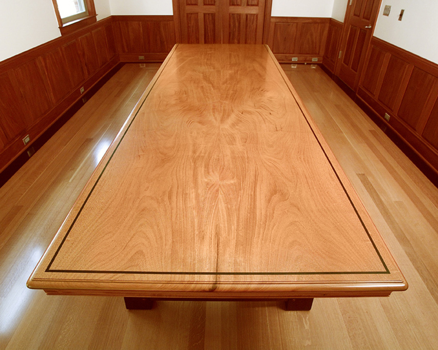 The top of the conference table shows the symmetry of the two board top with a wenge inlay.
