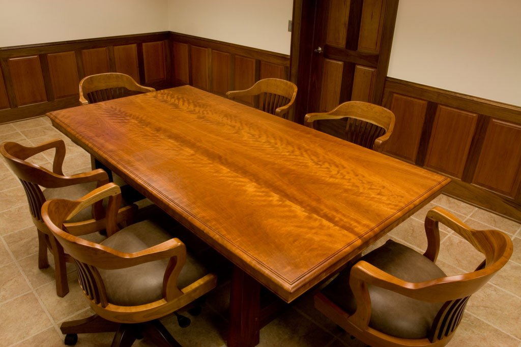 The same cherry and walnut conference table with its matching chairs and after it had a year to patina to its darker cherry color.